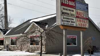 The Feed Bag Cafe featuring Smoke Daddy Smokehouse menu as well at night. .